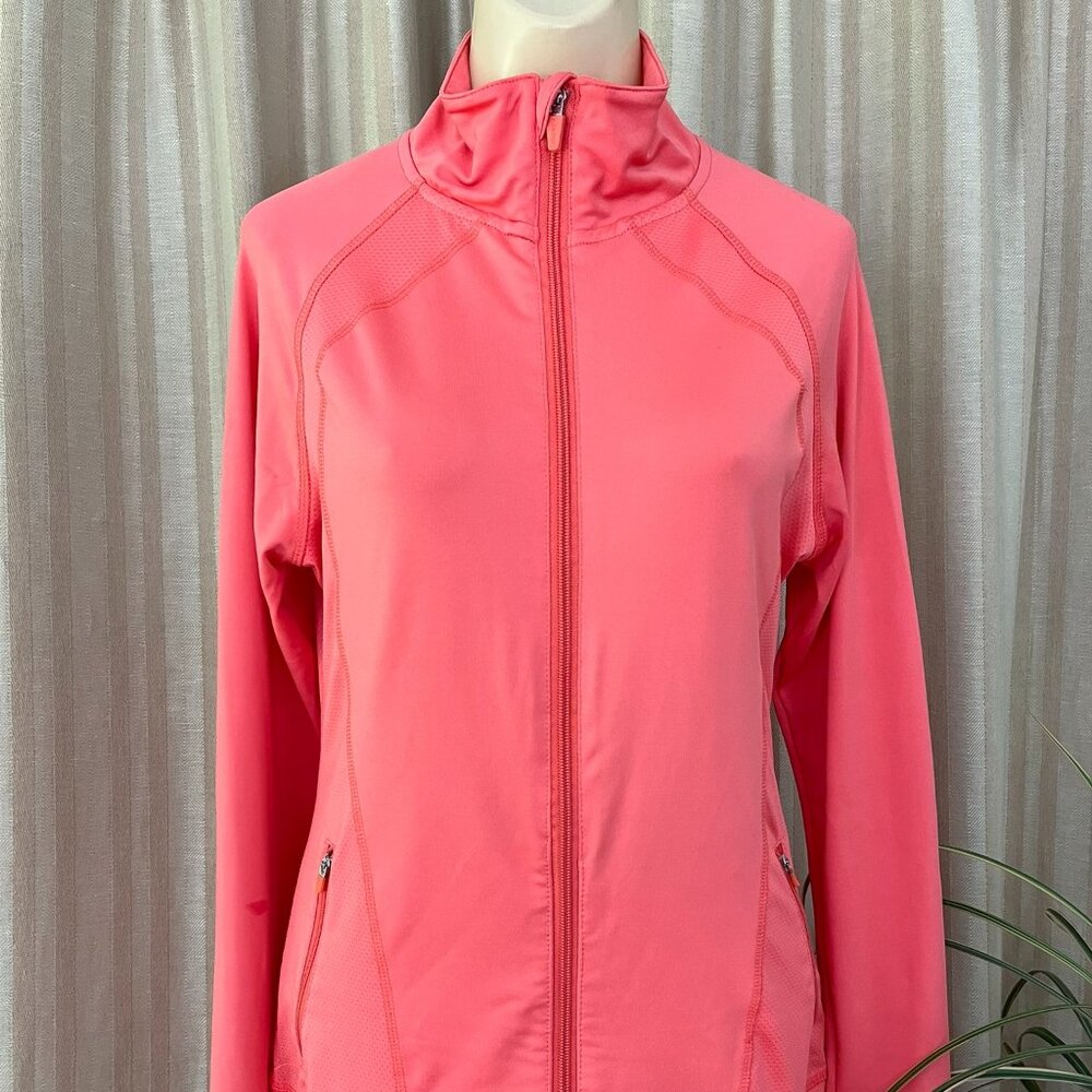 Jockey track jacket in coral with full zip, zippered pockets